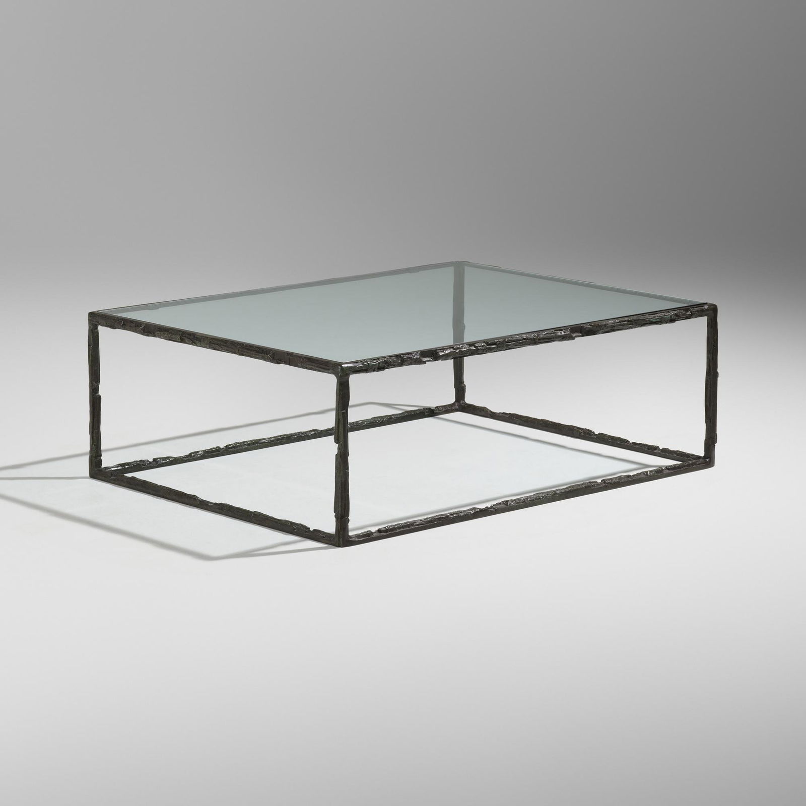 Bruno Romeda, Table: Bruno Romeda Table 2000bronze, glass 16 h x 48 w x 35.5 d in (41 x 122 x 90 cm) Stamped signature and date to base 'Romeda 2000'. This work will ship from Lambertville, New