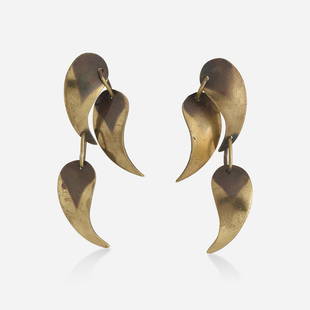 Art Smith, Brass earrings: Art Smith Brass earrings Each suspending three 'ego' pendants; late 1940s Brass Signed Art Smith 2.75 x 0.50 in; Gross weight 10.1 dwts Provenance: Property from the coll