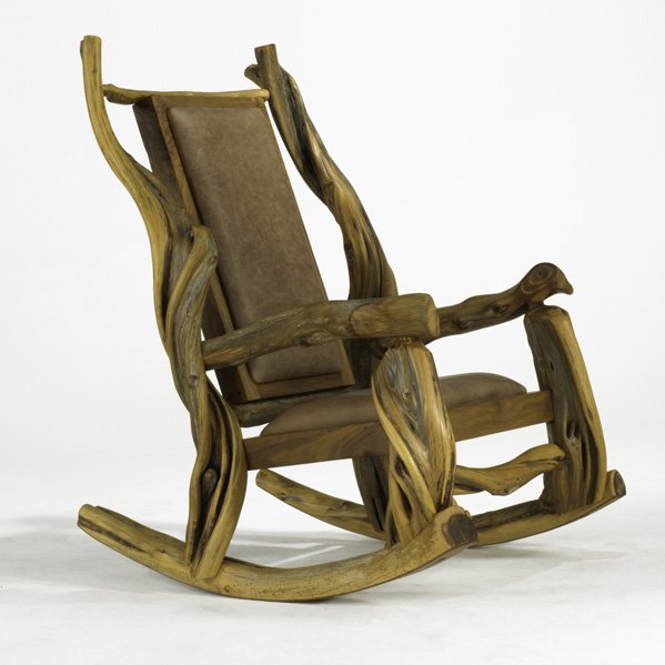 JUNIPER ROCKING CHAIR; USA, 1990s; Twisted branch: JUNIPER ROCKING CHAIR; USA, 1990s; Twisted branches, burl wood and leather; KITTO 87 7; 47'' x 28'' x 37 1/2''
