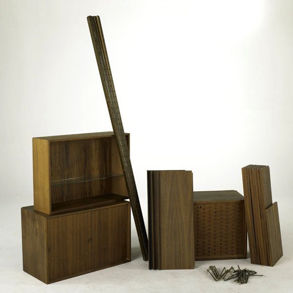 DANISH MODERN; Teak wall-mounted storage system, 1: DANISH MODERN; Teak wall-mounted storage system, 1960s; Consisting of: three cabinets, three bent plywood shelves, nine shelves, four verticals, twenty-two metal brackets and glass shelf; Unmarked; Ca