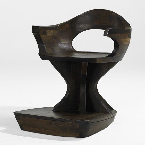 AMERICAN STUDIO; Chair on stand, USA, 1970s; Carv: AMERICAN STUDIO; Chair on stand, USA, 1970s; Carved laminated walnut; Unmarked; 36'' x 31 3/4'' x 36 1/2'' (with stand)