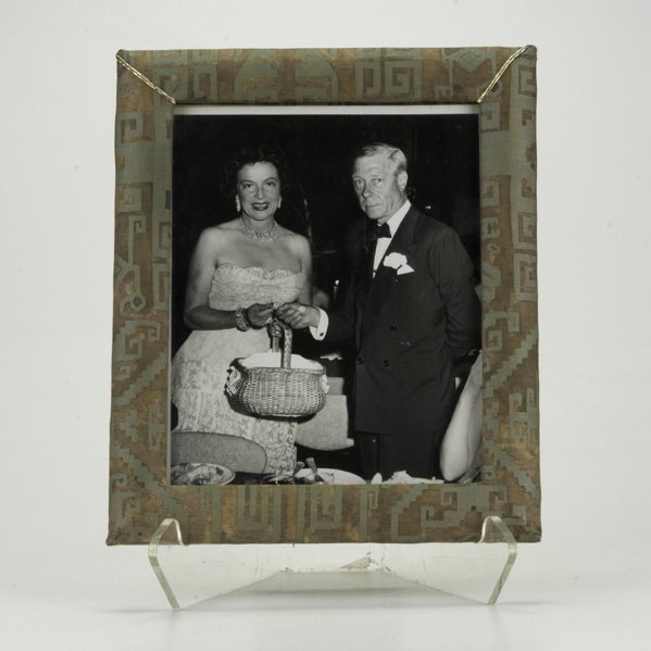 CARTIER; Picture frame in Fortuny patterned silk f: CARTIER; Picture frame in Fortuny patterned silk fabric with bouillon roping, with period photo of Duke of Windsor and unknown woman, 1950s; Embossed Cartier; 12 1/2'' x 10 1/2''