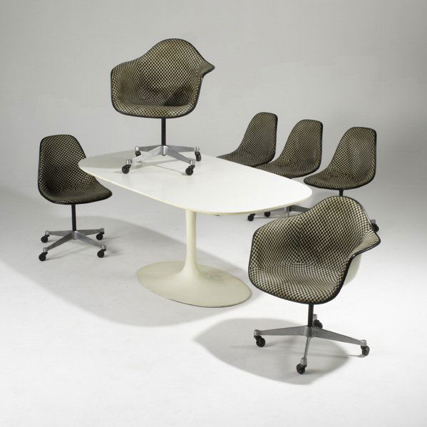 CHARLES AND RAY EAMES; HERMAN MILLER; BURKE; Set o: CHARLES AND RAY EAMES; HERMAN MILLER; BURKE; Set of six dining chairs, two arm four sides with Alexander Girard fabric together with a Tulip extension table, USA, 1960s; Chairs embossed, some with pap