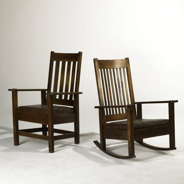 STICKLEY BROTHERS; Spindle back armchair and rocke: STICKLEY BROTHERS; Spindle back armchair and rocker, each with loose seat cushion, Quartersawn oak and leather, early 20th c.; Unmarked; Armchair: 42 1/2'' x 37 1/2'' x 25''