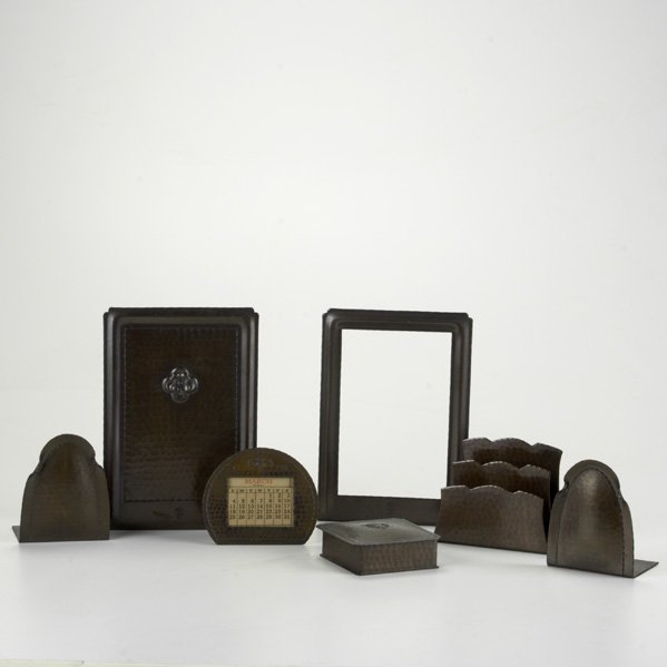 ROYCROFT; Seven hammered copper pieces: pairs of b: ROYCROFT; Seven hammered copper pieces: pairs of bookends, frame, desk calendar, stamp box, and letter holder; All marked; Tallest 8 1/2''
