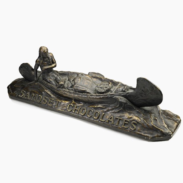 SAMOSET CHOCOLATES ADVERTISING: SAMOSET CHOCOLATES ADVERTISING; Painted plaster with Native American in a canoe, 20th c.; Stamped R. Farrington Elwell; 11 1/2'' x 36'' x 9 1/4''