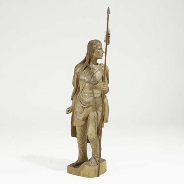 CARVING OF NATIVE AMERICAN: CARVING OF NATIVE AMERICAN; Carved wood holding a spear, 20th c.; 52''