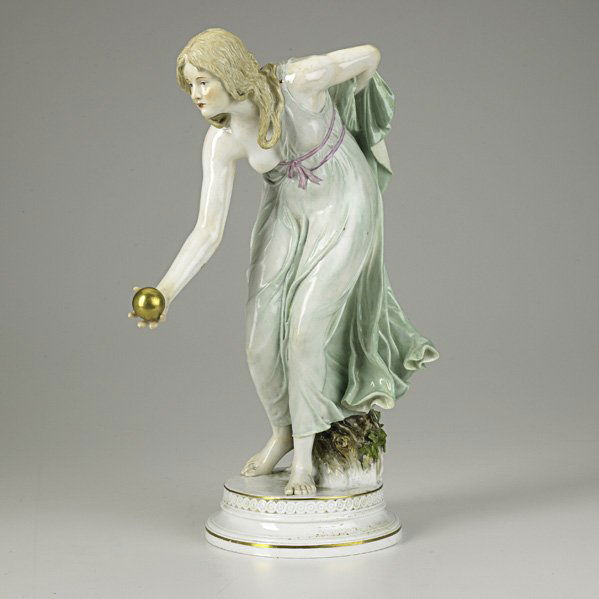 MEISSEN: MEISSEN; Porcelain figure of a partially dressed woman with a golden orb in her hand, 19th/20th c; Crossed swords mark; 14 1/2'' x 5 1/2'' x 10''