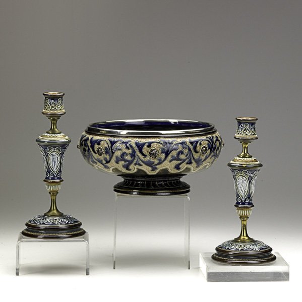 DOULTON LAMBETH: DOULTON LAMBETH; Assembled stoneware garniture set comprised of silver-mounted center bowl with incised floral decoration and similar brass-mounted candlesticks, late 19th c.; All with impressed mark,
