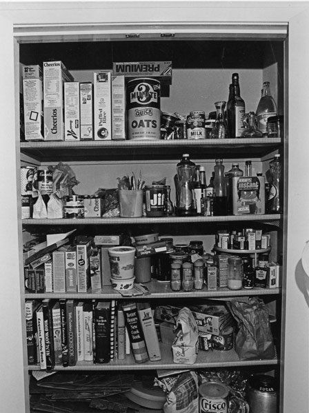 Bill Owens (American, b.1938): Untitled (Open pantry Joy of Cooking), 1972; Gelatin silver print (printed 2008); Signed and numbered AP 5/15; 13 3/8" x 10 1/8" (image); 14" x 11" (sheet); Provenance: Private Collection, New York