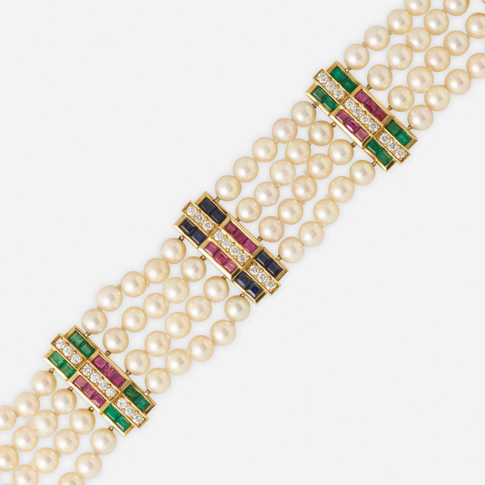 Julius Cohen, Cultured pearl, gem-set bracelet: Julius Cohen Cultured pearl, gem-set, and diamond bracelet Designed with four rows of cultured pearls, spaced by stations set with square-cut rubies, emeralds, sapphires, and round brilliant-cut diamo