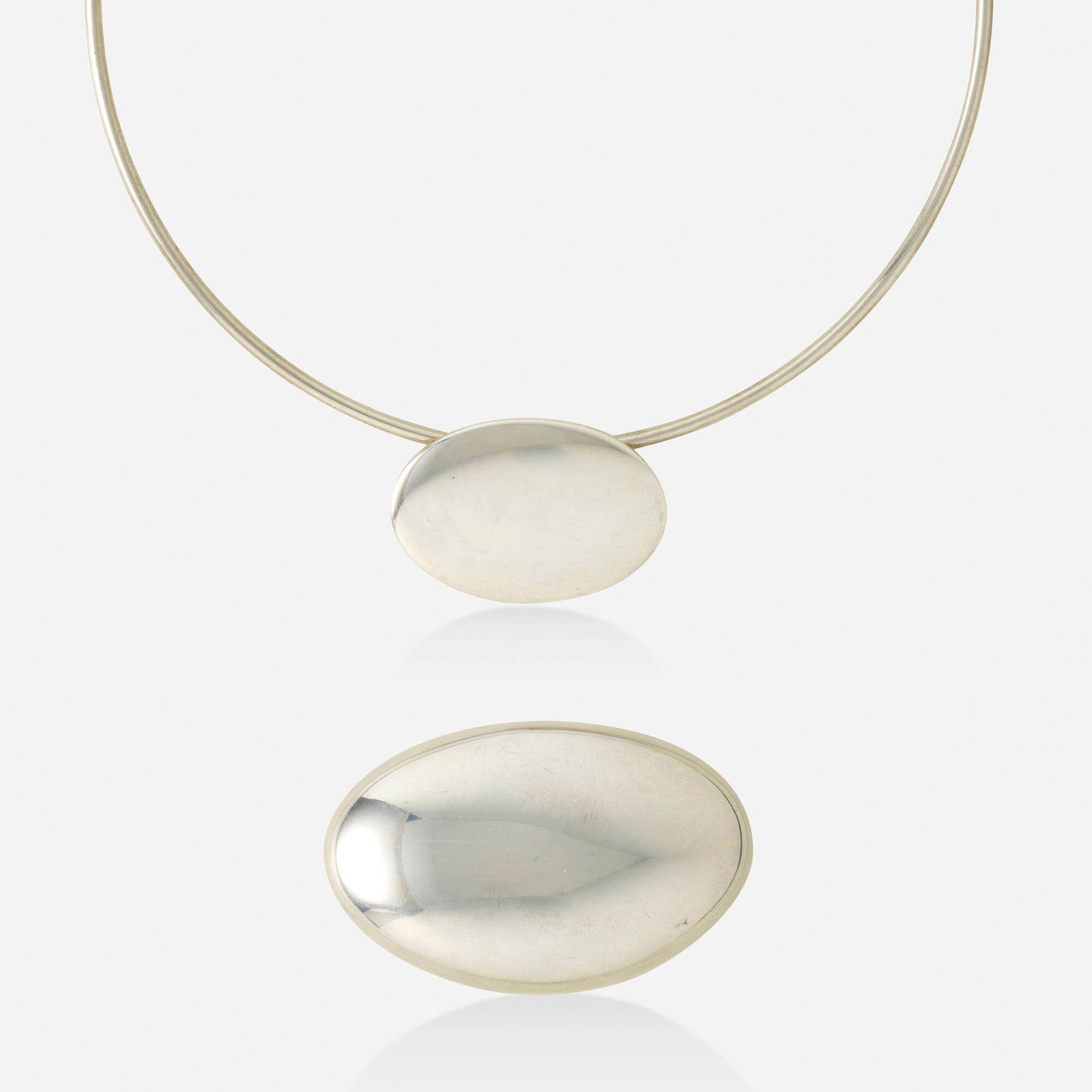Tiffany & Co., Sterling silver box and necklace: Tiffany & Co. Sterling silver box and necklace Comprising a wire collar necklace with an oval pendant; together with an oval pill box Sterling silver Signed Tiffany & Co. to each Necklace inner circ