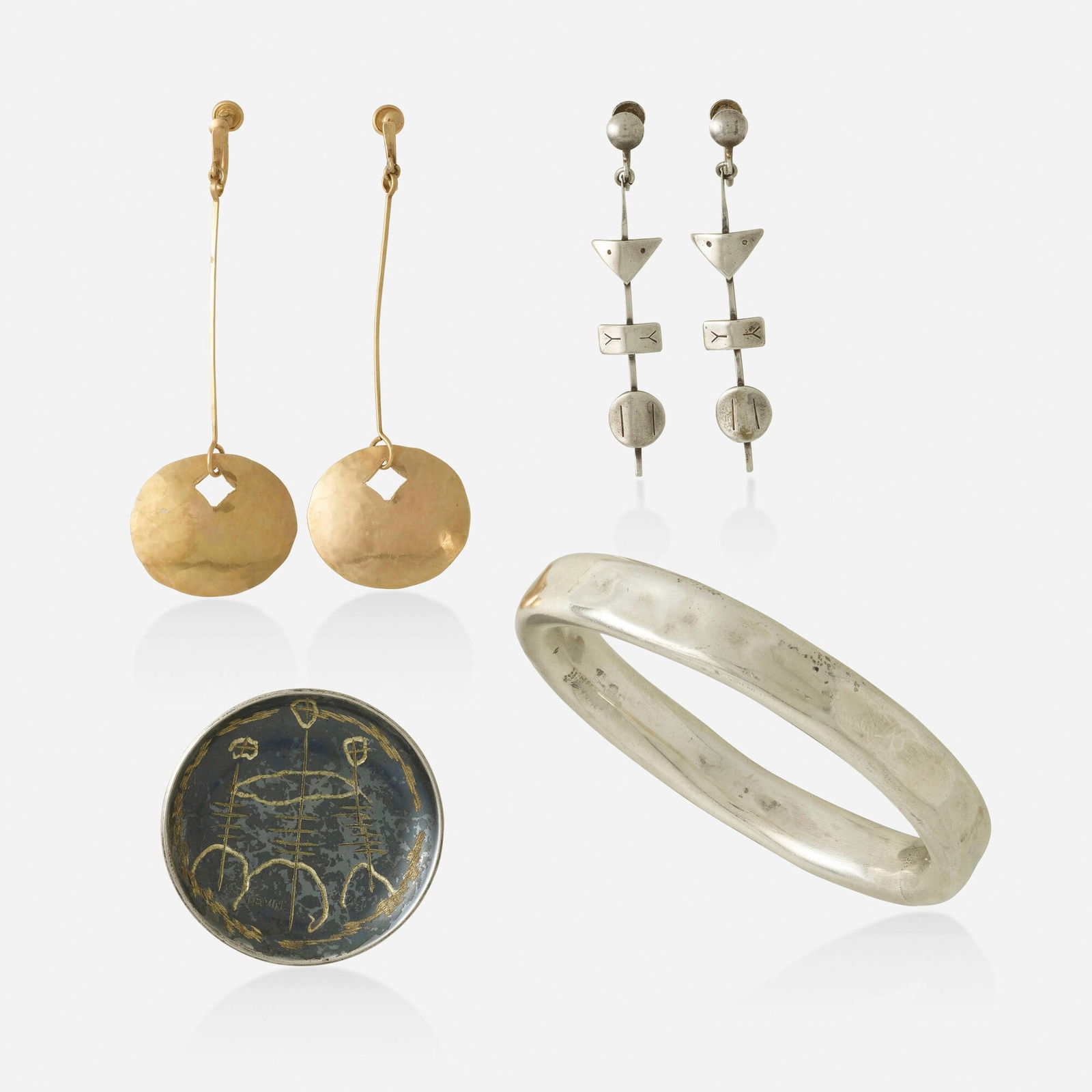 Ed Levin, Group of sterling and gold jewelry: Ed Levin Group of sterling silver and gold jewelry Comprising a pair of geometric shape earrings; a pair of hammered gold earrings; an etched brooch; and a hammered bangle bracelet Sterling silver and