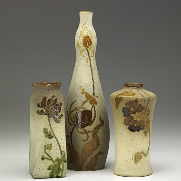 ROSEVILLE Three vases, Woodland & Fujiyama: ROSEVILLE Two Woodland and one Fujiyama enamel decorated vases, Zanesville, OH, 1905; Rozane Ware seal to Woodland, Fujiyama stamp; Tallest: 11 1/4" x 3 1/4"