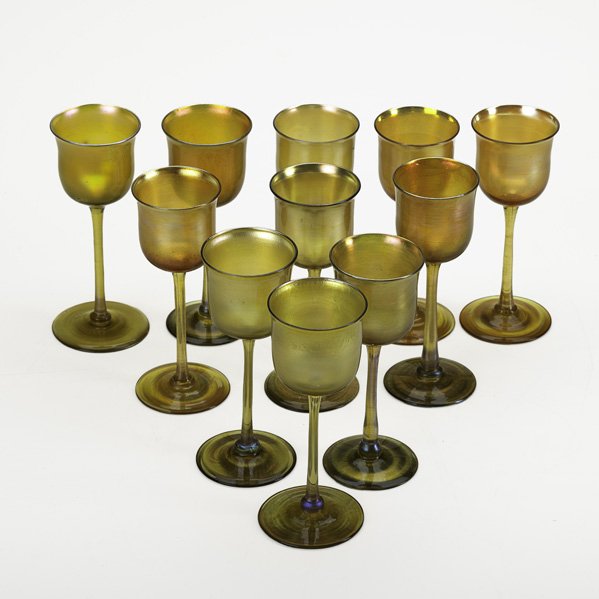 TIFFANY STUDIOS Set of eleven cordial glasses: TIFFANY STUDIOS Eleven gold Favrile glass cordial glasses, New York, 1920's; All signed L.C.T, two with numbers.; Each: 5 1/4" x 2"