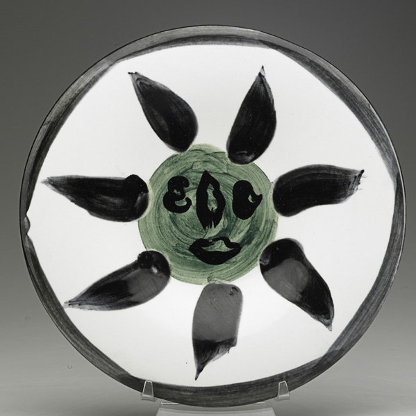 PABLO PICASSO; MADOURA Plate with sun: PABLO PICASSO (1881-1973) MADOURA Glazed faience plate with sun, France; Signed N. 127 EDITION PICASSO 131/150 MADOURA; 10" dia.