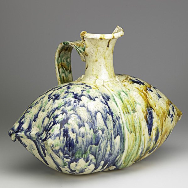BETTY WOODMAN Pillow pitcher: BETTY WOODMAN (b. 1930) Large glazed faience Pillow pitcher, New York, 1980s; Stamped Woodman; 16 3/4" x 21" x 13"