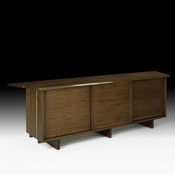 GEORGE NAKASHIMA Special triple cabinet: GEORGE NAKASHIMA NAKASHIMA STUDIOS Special triple cabinet, New Hope, PA, 1957; Double-overhang freeform edge and pull-out surface; Persian walnut, black walnut, oak; Signed with client's name, brass l