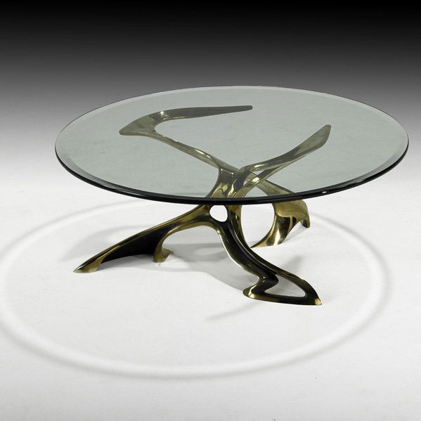 BOB BENNETT "Concepts" Coffee table: BOB BENNETT "Concepts" coffee table, California, 1980s; Cast brass, glass; Unmarked; 14" x 36" dia. Provenance: Purchased directly from artist, copies of original receipts available.