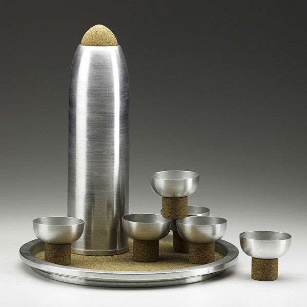 RUSSEL WRIGHT Cocktail shaker & cups on tray: RUSSEL WRIGHT Rare bullet-shaped cocktail shaker and six cups on tray, USA, 1930s; Spun aluminum, cork, cedar; Cups and tray stamped RUSSEL WRIGHT, shaker stamped RUSSEL PATENT APPLIED FOR; Tray: 12 1