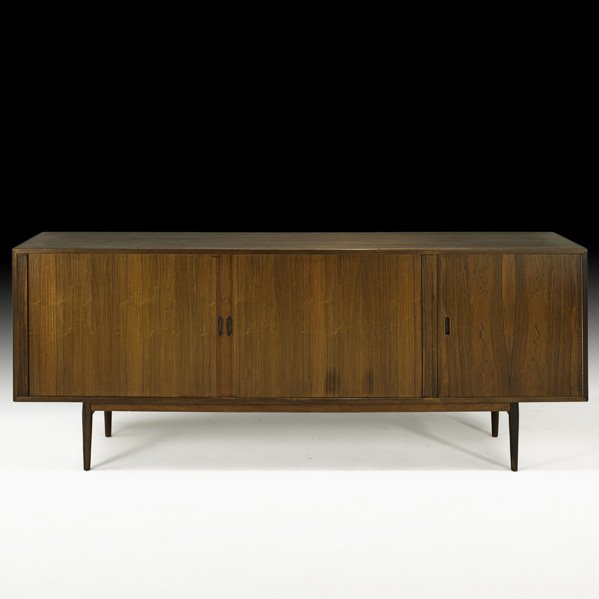 ARNE VODDER Rosewood and elm cabinet: ARNE VODDER SIBAST MOBLER Cabinet, Denmark, 1960s; Rosewood, elm, laminate; Featuring two tambour doors, five adjustable shelves, six drawers, finished back; Metal labels; 35" x 89" x 18 1/2"