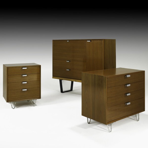 GEORGE NELSON Walnut dresser suite: GEORGE NELSON HERMAN MILLER Two dressers, secretary cabinet, bench and bridge vanity, USA, 1950s; (Bridge vanity not pictured); Walnut, zinc-plated metal, aluminum, foil labels; Larger dresser: 29 1/2