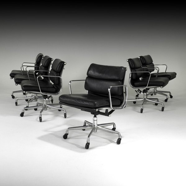 CHARLES AND RAY EAMES Six Soft Pad armchairs: CHARLES AND RAY EAMES HERMAN MILLER Set of six Soft Pad armchairs, USA, 1990s; Polished aluminum, leather, enameled metal, casters; Manufacturer's paper labels; 32" x 22 1/2" x 23 1/2"