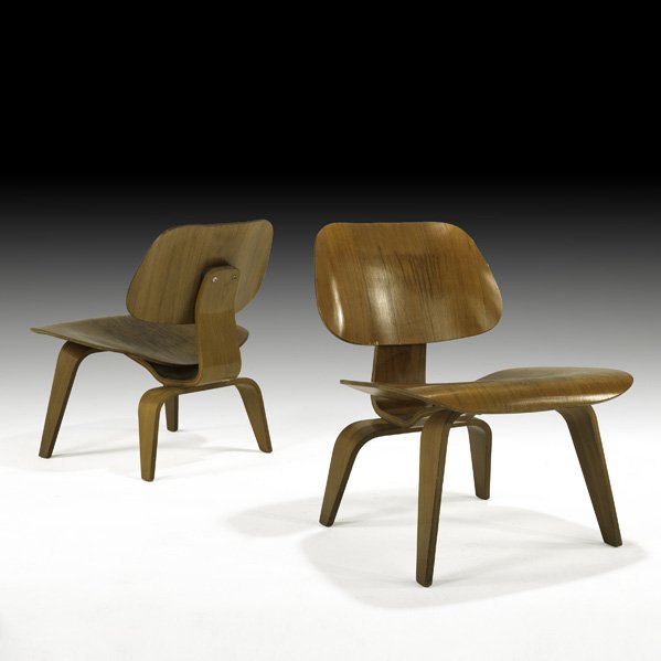CHARLES AND RAY EAMES Pair of LCW: CHARLES AND RAY EAMES HERMAN MILLER Pair of lounge chairs (LCW), USA, 1950s; Walnut, plywood, rubber; Remnants of labels; 26 1/2" x 22 1/4" x 25"