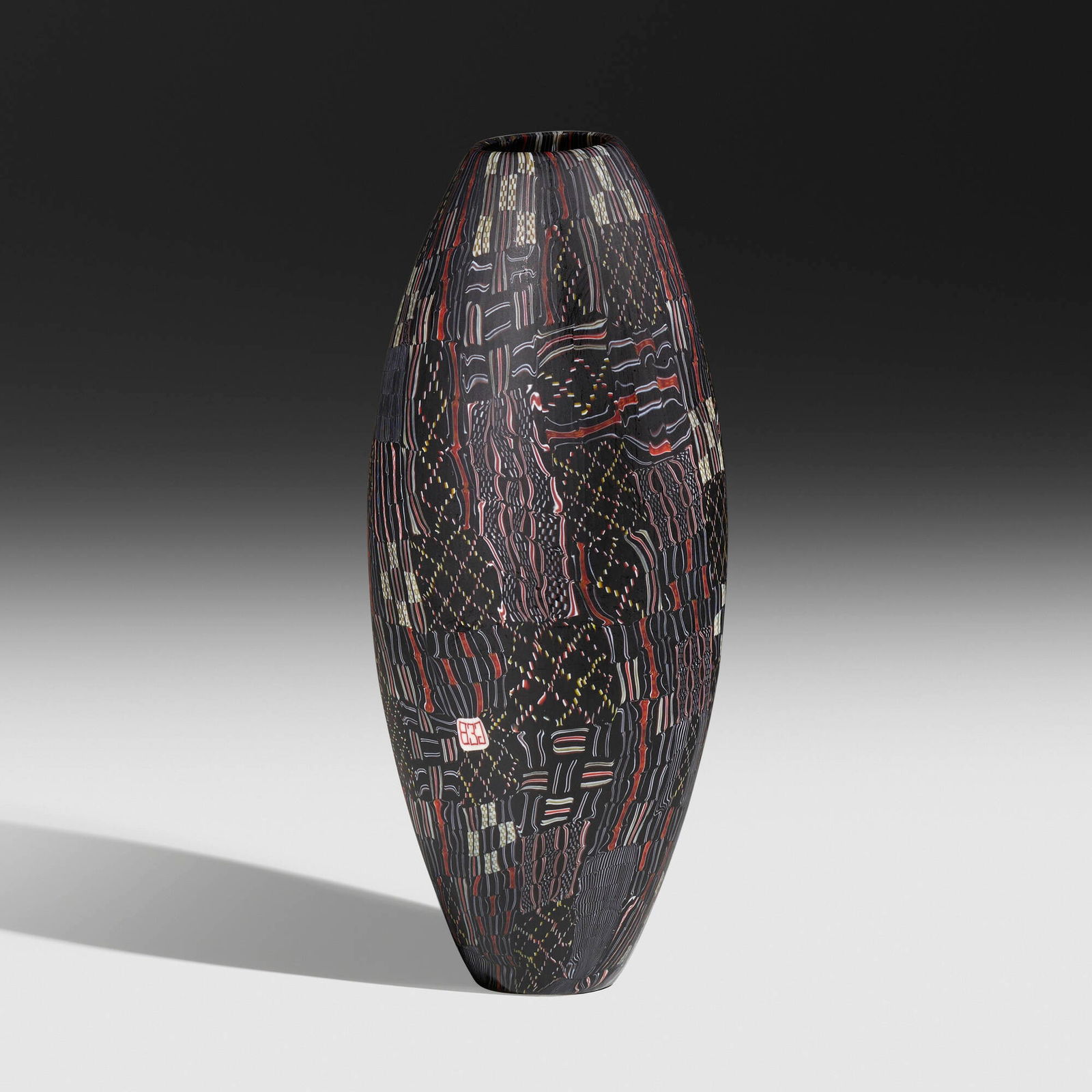 Giles Bettison, Black No. 11 (from the Black series): Giles Bettison Black No. 11 (from the Black series) Australia, 1999cold-assembled and hot-formed murrine, ground surface 11 h x 4.5 dia in (28 x 11 cm) Etched signature to underside 'Bettison'