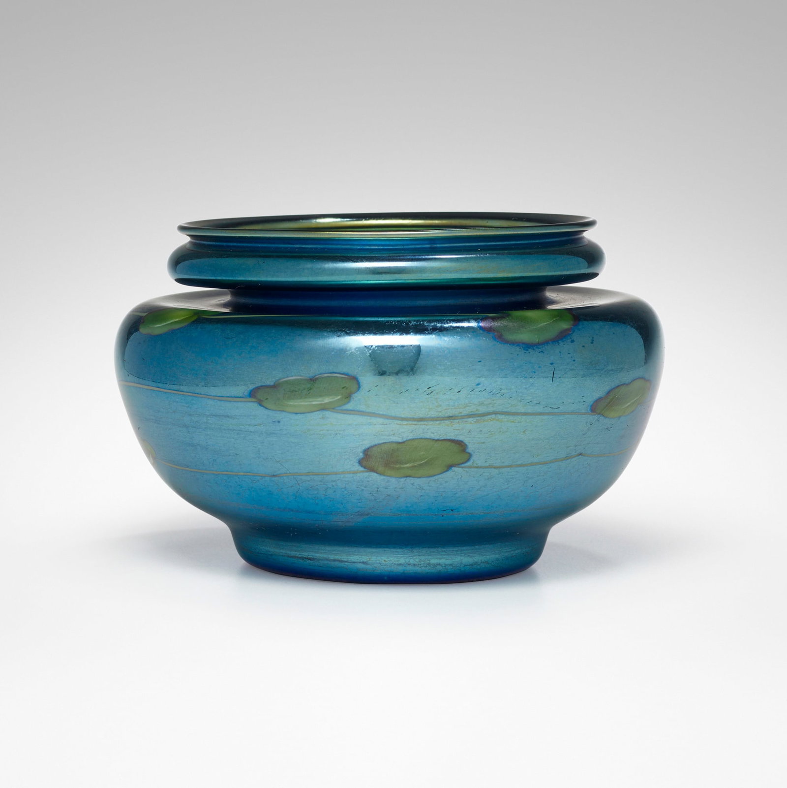 Tiffany Studios, Leaf and Vine bowl: Tiffany Studios Leaf and Vine bowl USA, c. 1918 hand-blown Favrile glass, iron 3.75 h x 6 dia in (10 x 15 cm) Etched to underside '1519-4061M L.C. Tiffany Inc - Favrile'. Provena
