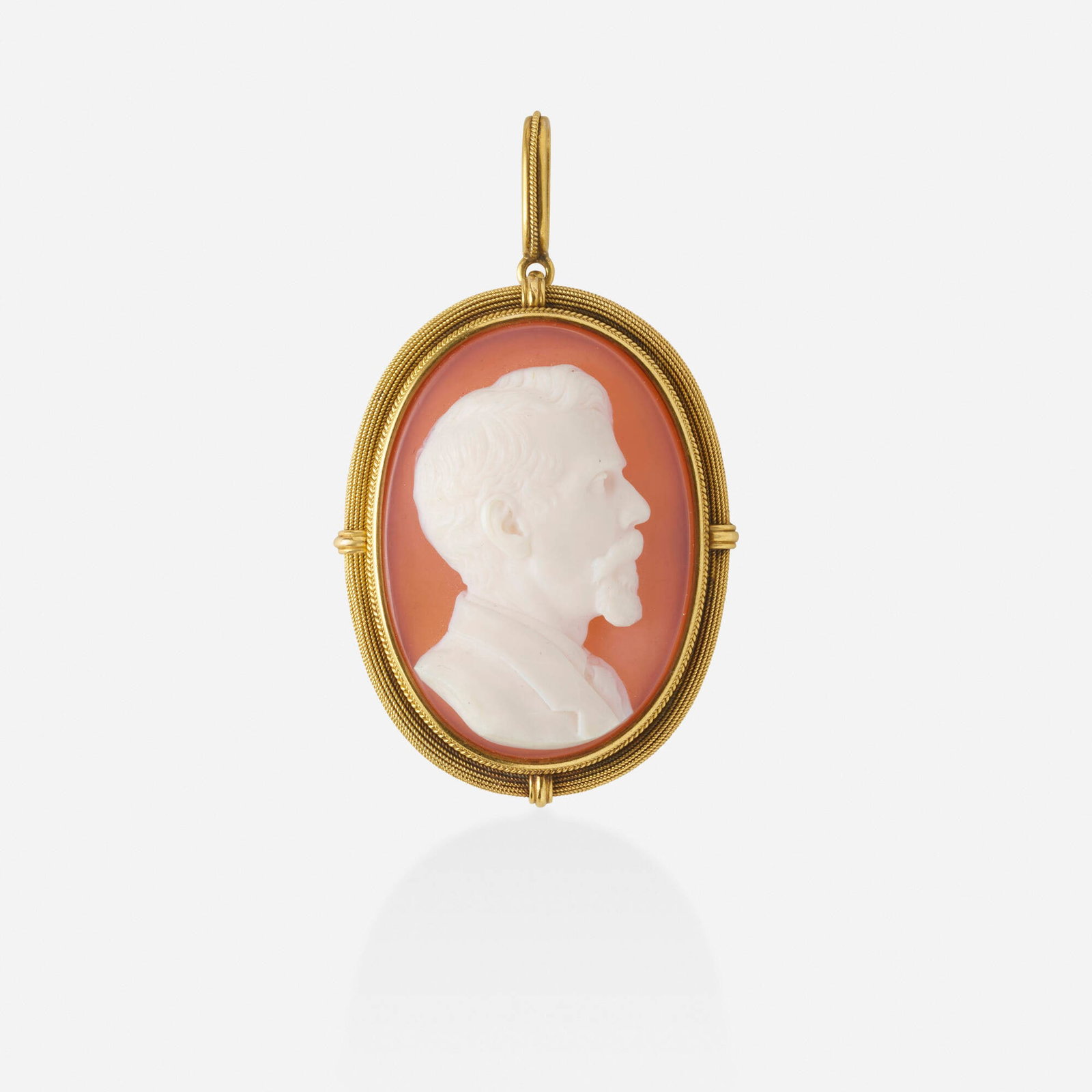 Italian, Antique sardonyx cameo pendant brooch: Italian Antique sardonyx cameo and gold pendant brooch The sardonyx cameo depicting Frederick Norton Finney in a roped gold frame, engraved 'F.N.Finney 1889' on reverse; c. 1889 Yellow gold 1.75 x 1.2