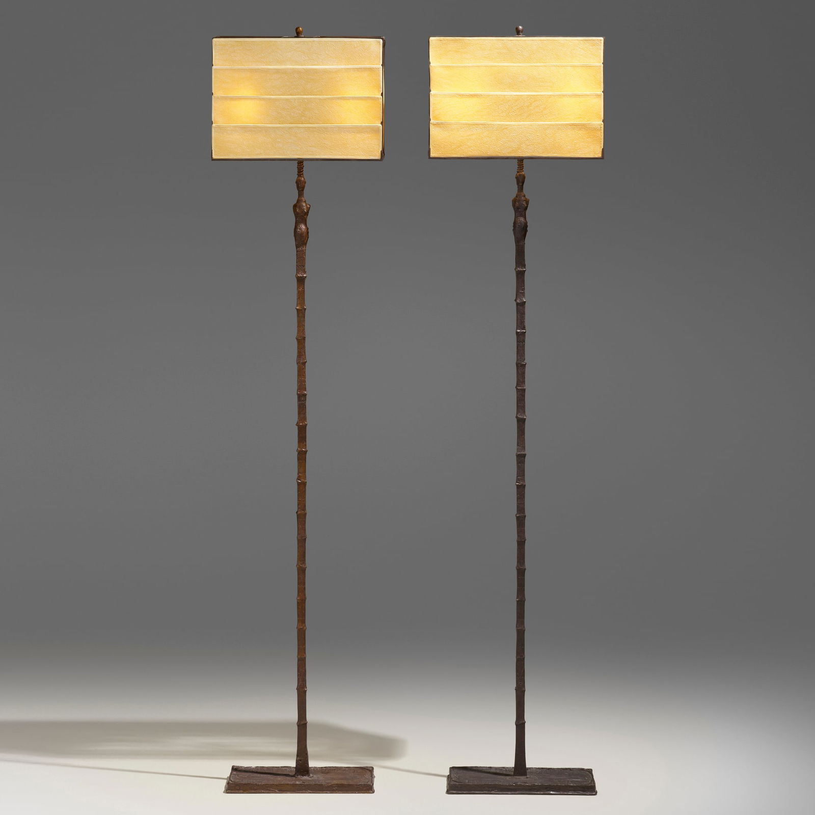Ingrid Donat, Femme Girafe floor lamps, pair: Ingrid Donat Femme Girafe floor lamps, pair Sweden/France, 2003patinated bronze, parchment each: 80 h x 18 w x 10.75 d in (203 x 46 x 27 cm) Impressed signature, number, and foundry mark to to