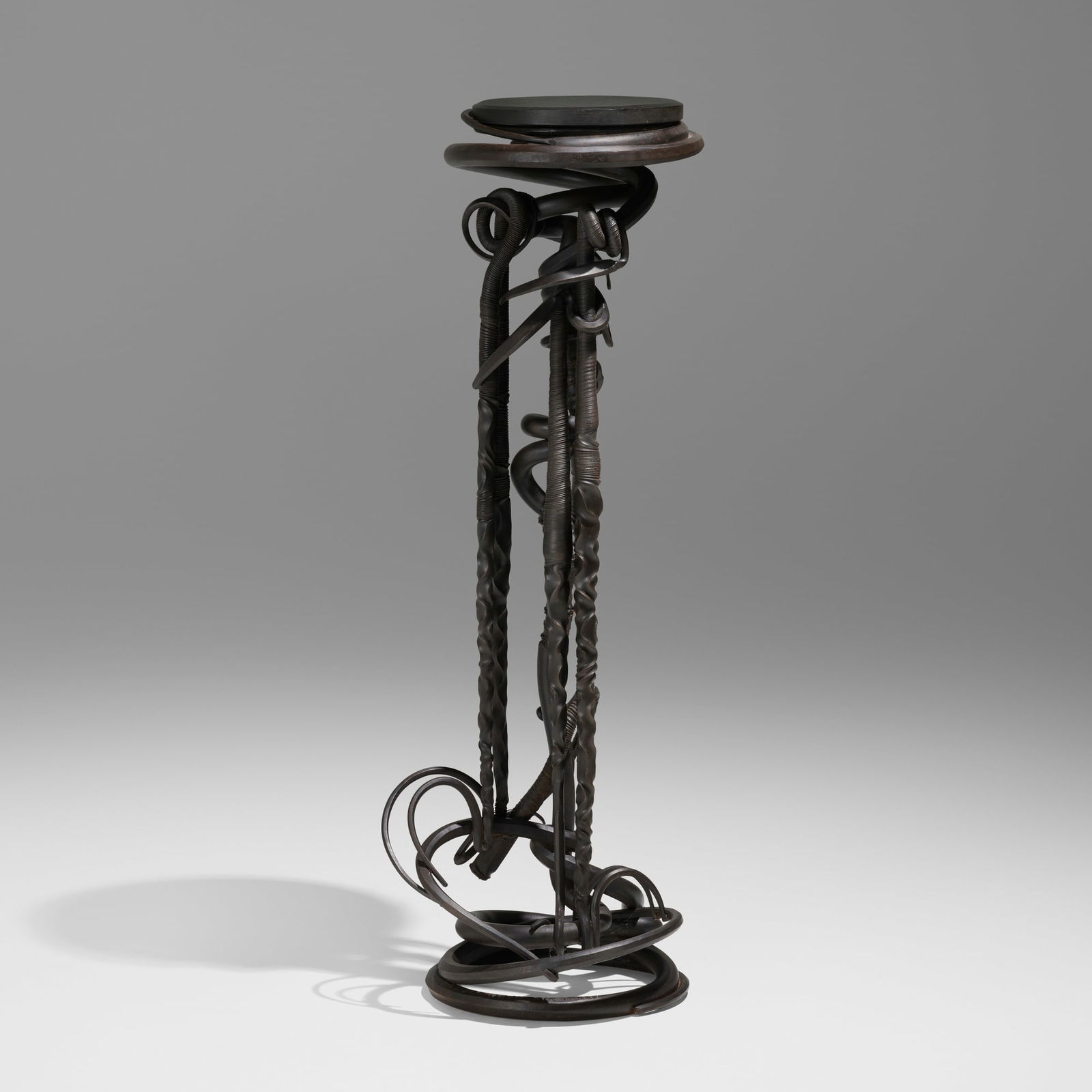 Albert Paley, Plant stand: Albert Paley Plant stand USA, 1984forged and fabricated steel with a blackened finish, slate 53 h x 16.5 dia in (135 x 42 cm) Incised signature and date to base 'Paley Studios LTD © 1984'.