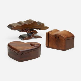 Richard Rothbard, Collection of three puzzle boxes: Richard Rothbard Collection of three puzzle boxes USA, late 20th centurymyrtle, black walnut, padouk 4.5 h x 11 w x 3 d in (11 x 28 x 8 cm) 3.75 h x 6.75 w x 4 d in (10 x 17 x 10 cm) 2.75 h x 7