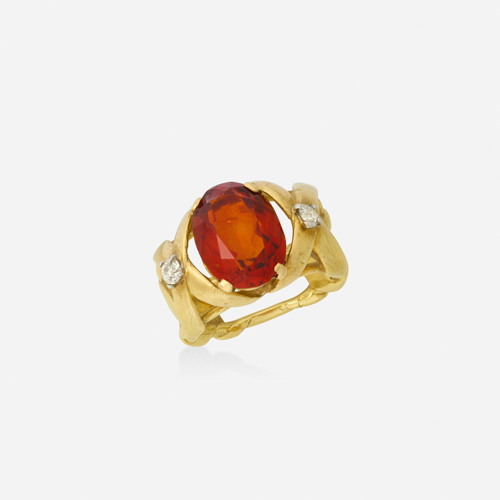 Louis Feron, Madeira citrine, diamond, gold ring: Louis Feron Madeira citrine, diamond, and gold ring Set with an oval-cut Madeira citrine, flanked by old mine-cut diamonds, with an 'X' motif band Yellow gold Signed LF Ring size 7.50; Gross weight