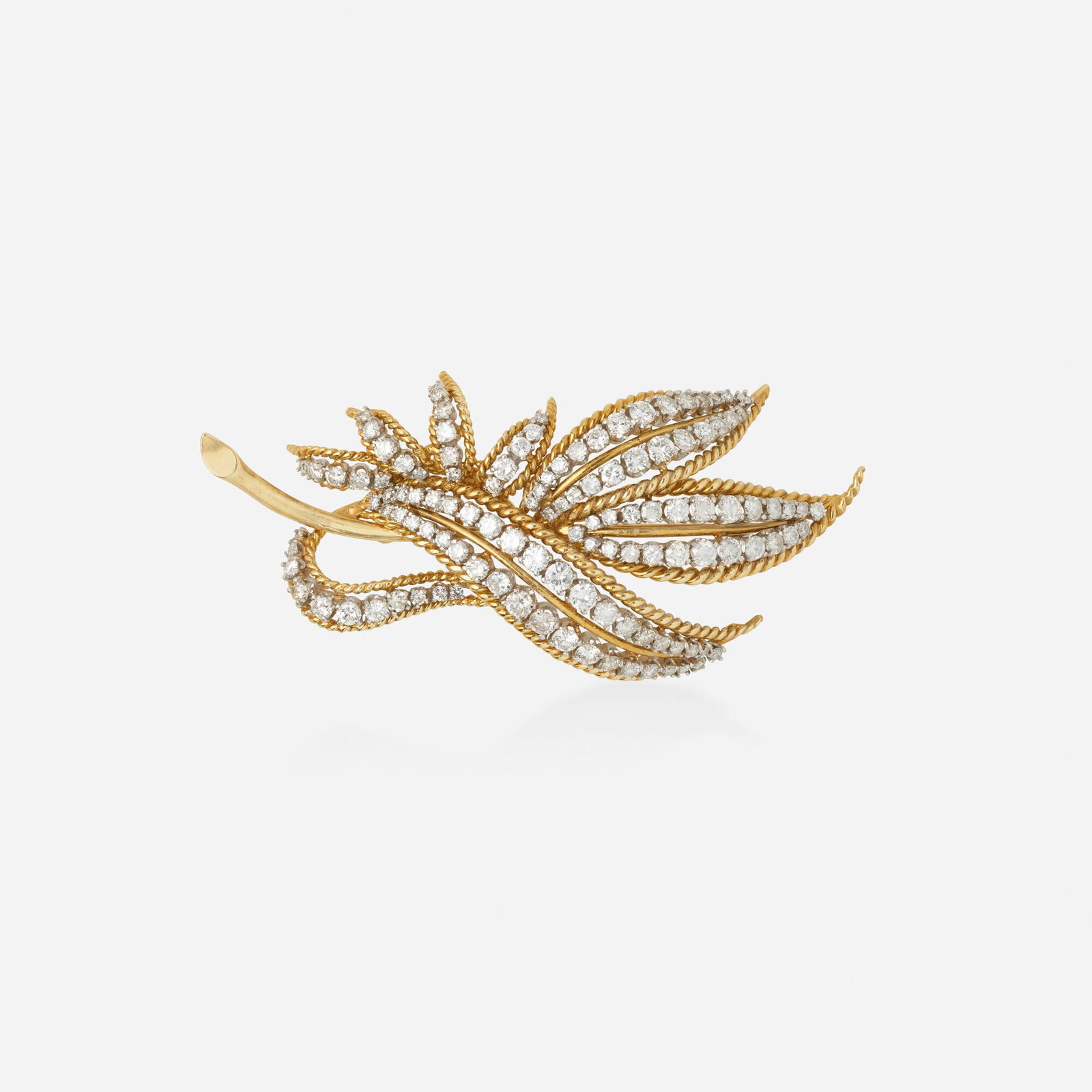 Diamond and bicolor gold brooch: Diamond and bicolor gold brooch The foliate brooch of roped gold set with round brilliant-cut diamonds 18k yellow and white gold 3 x 1.25 in; Gross weight 18.6 dwts This work will ship from Lambertvil