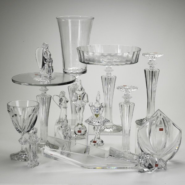 BACCARAT: Fifteen crystal items include: pair of candlesticks, footed compote, footed cake plate, (7) figurines, etc., 20th c.; All marked; Tallest: 23"