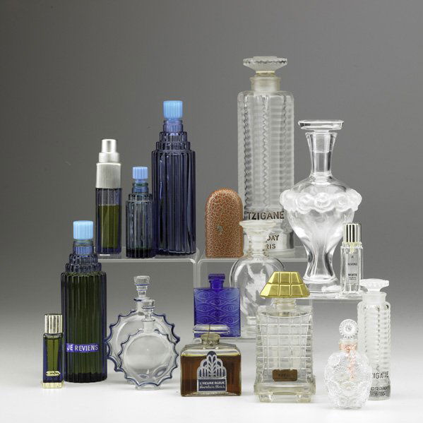 LALIQUE, ETC.: LALIQUE, ETC; Seventeen perfume bottles, 20th c.; "Lilas" for Worth, "Je Reviens," Marcel Rochas, Guerlain "L'Heure Bleue," Caron, "Tzigane," "Requette," "L'Origan de Coty," "Martine" and "Les Yeux Bl