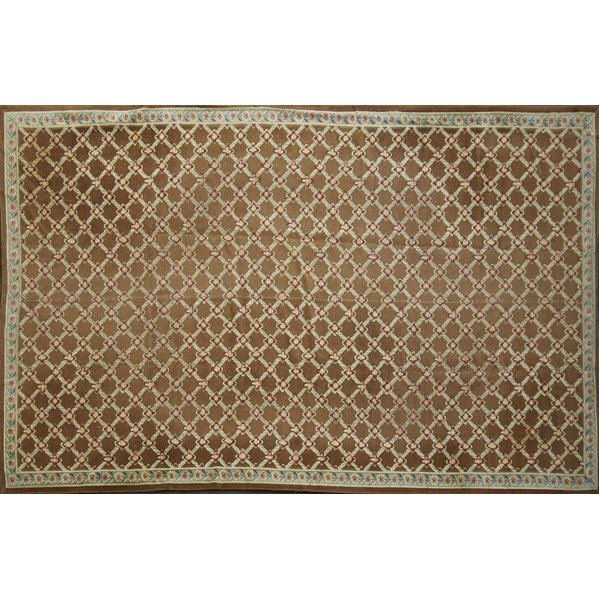 STARK ROOM SIZE RUG: All-over floral diamond design on brown ground, 20th c.; 192" x 104"