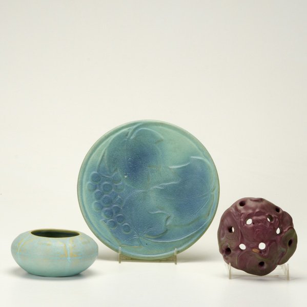 VAN BRIGGLE: Three pieces: Cabinet bowl in teal, Persian Rose flower frog, and plaque with grape bough in blue over teal; All marked; Plaque 8 1/2" dia.