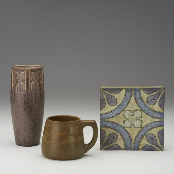 AMERICAN ART POTTERY: Three pieces: Rookwood vase in frothy aubergine, 1923, Walrath mug with apples, and Wheatley tile; All marked; Tallest: 8"