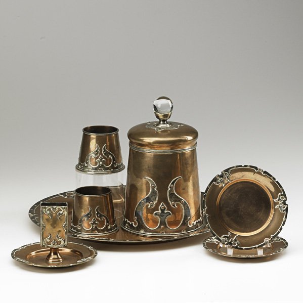 JOSEPH HEINRICHS (Attr.): Seven-piece smoking set: humidor, matchbox holder, serving tray, ashtrays and two cylindrical match holders, New York, ca. 1900; Silver, copper and glass; Each stamped STERLING SILVER & OTHER METALS 9