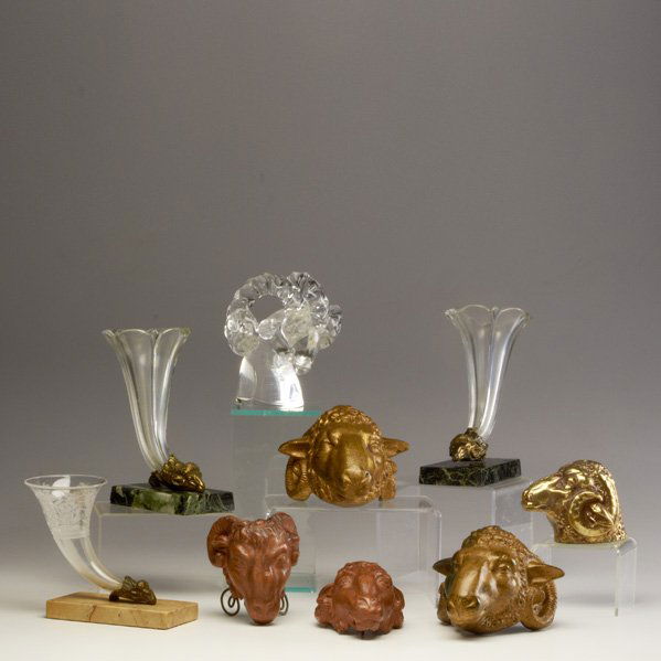 RAM'S HEAD GROUP: Nine pieces, 19th/20th century: Cartier crystal, pair terra-cotta, pair gilt bronze, three epergnes; Cartier marked; Tallest: 8"