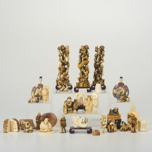 CARVED IVORY: Twenty-five netsukes, figures and snuff bottles, 20th c.; Some signed; Tallest: 5 1/4"