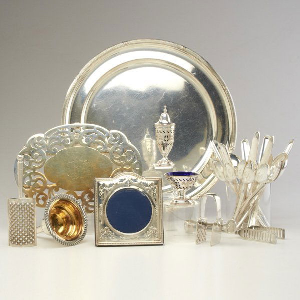 COLLECTION OF SILVER PLATE: Forty-two pieces: funnel, 6 1/2"; trivet; zester; asparagus tongs, 8 3/4"; roast clamp, 4"; picture frame; serving tray; (25) ice tea spoons; (8) double marrow scoops; pierced salt dip and pepper shak