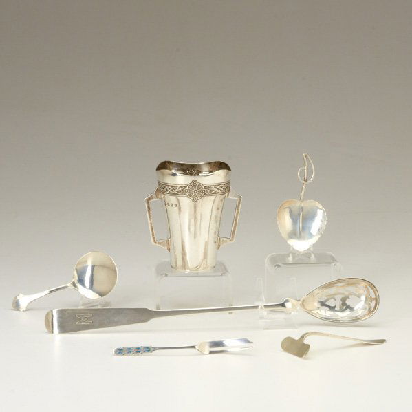 ARTS AND CRAFTS STYLE SILVER: Six items, 1900-1930: Porter Blanchard pierced serving spoon with applied monogram M, 12 1/2"; Liberty & Co. hors d'oeuvre fork with enameled handle, 5"; Arthur Stone mint spoon; Pratt leaf-form mint