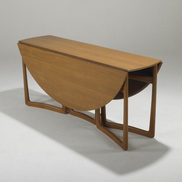 PETER HVIDT AND ORLA MOLGAARD-NIELSEN: FRANCE AND SON; Drop-leaf dining table, Denmark, 1960s; Teak and brass; Unmarked; Closed: 28" x 64" x 18"