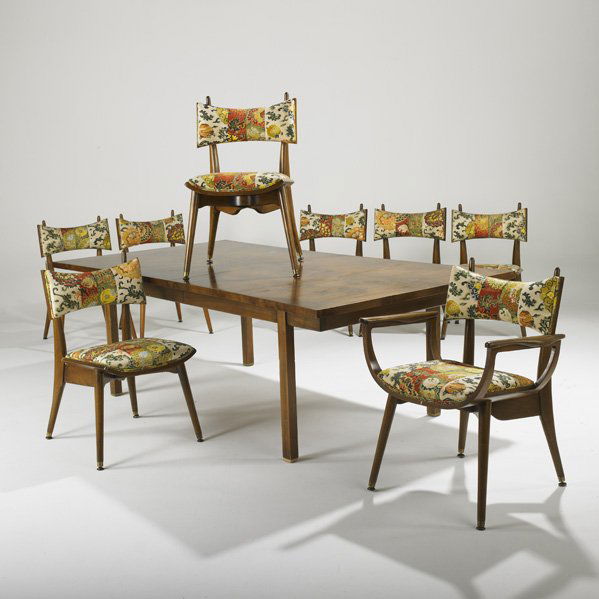 HAROLD SCHWARTZ: Dining table and eight chairs (one arm and seven side), USA, 1950s; Burl wood, stained birch, upholstery and brass; Table: stenciled marks; Table: 27 1/2" x 84 1/2" x 46"(two leaves each: 18"), chair: