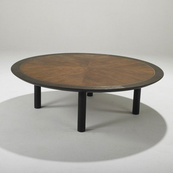 BAKER: Circular coffee table, USA, 1950s; Walnut, ebonized wood and brass; Unmarked; 15" x 49" dia