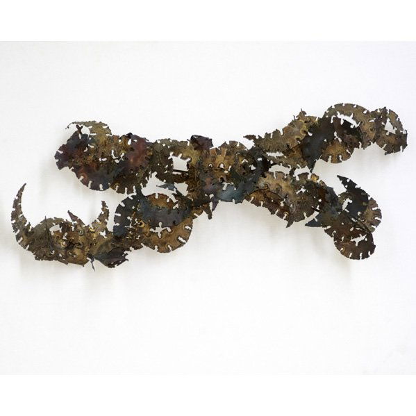 SILAS SEANDEL: Abstract wall sculpture, USA, 1970s; Pierced-cut and patinated brass; Signed; 44" x 19" x 7"
